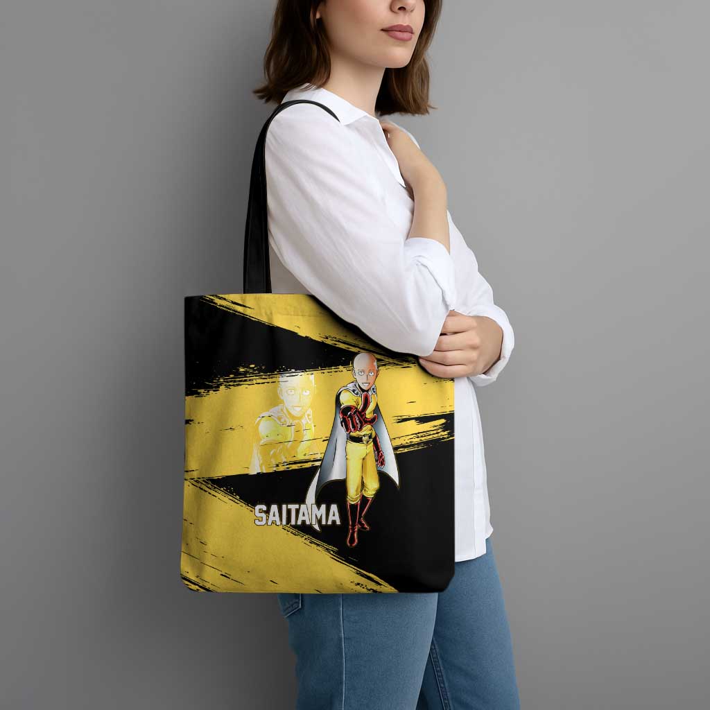 Saitama One Punch Man Anime Yellow and Black Theme Tote Bag with Heroic Pose and Dynamic Brushstroke Background - The Mazicc