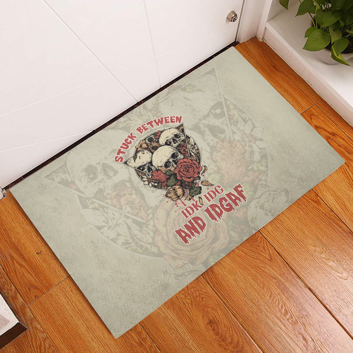 stuck-between-idk-idc-and-idgaf-skull-rubber-doormat