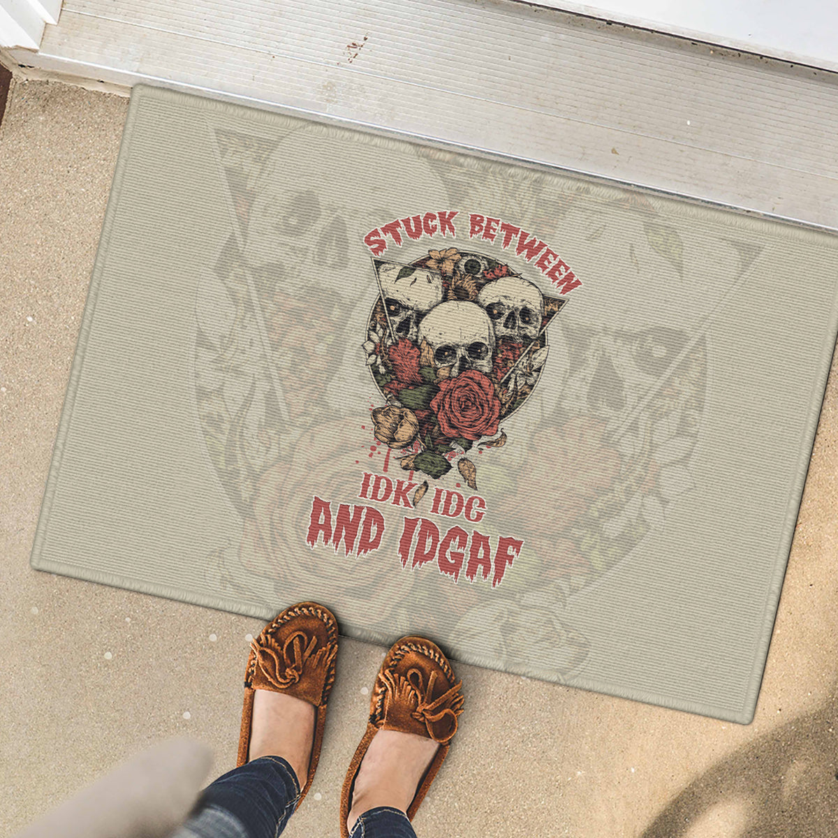stuck-between-idk-idc-and-idgaf-skull-rubber-doormat