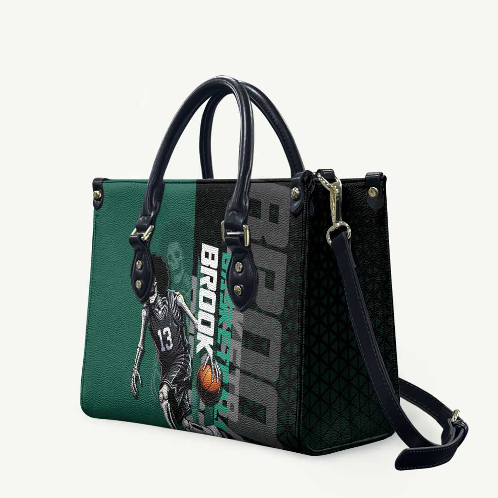 Brook One Piece Basketball Theme Green and Black Design Leather Bag with Skull Emblem and Energetic Pose - The Mazicc