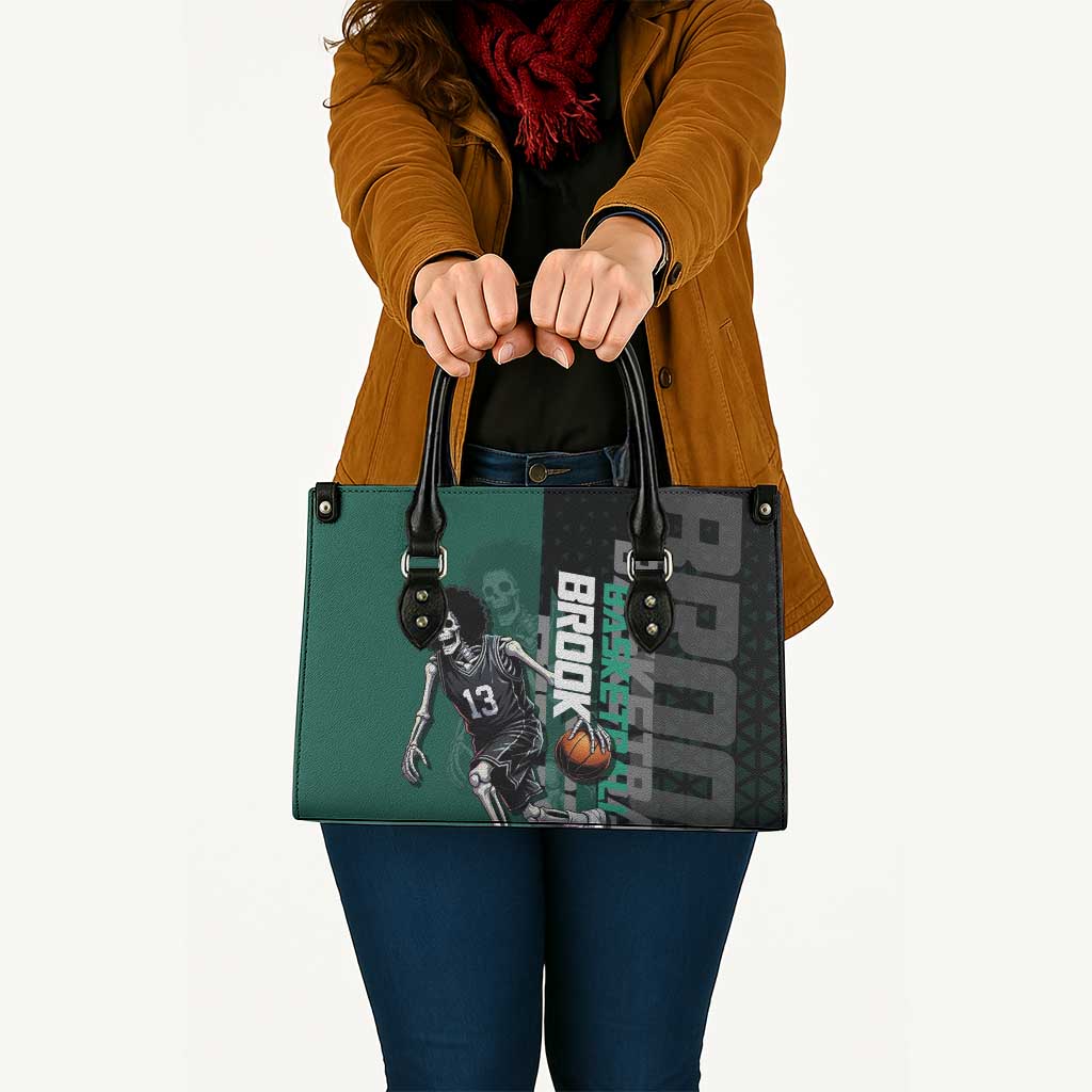 Brook One Piece Basketball Theme Green and Black Design Leather Bag with Skull Emblem and Energetic Pose - The Mazicc