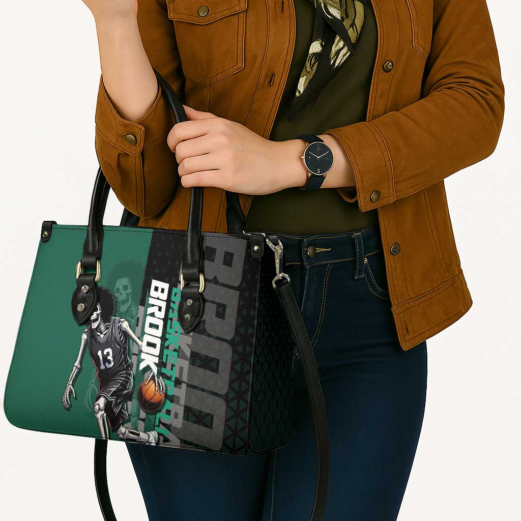 Brook One Piece Basketball Theme Green and Black Design Leather Bag with Skull Emblem and Energetic Pose - The Mazicc