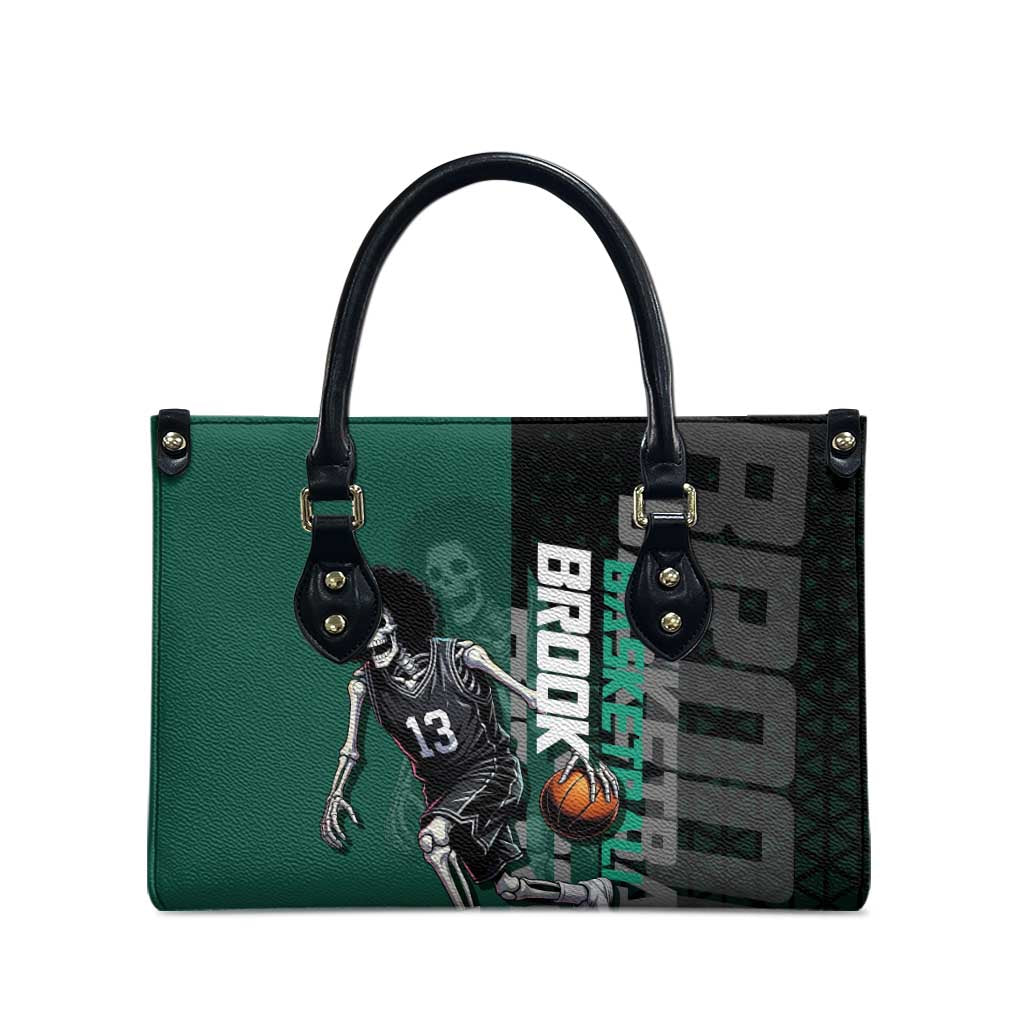 Brook One Piece Basketball Theme Green and Black Design Leather Bag with Skull Emblem and Energetic Pose - The Mazicc