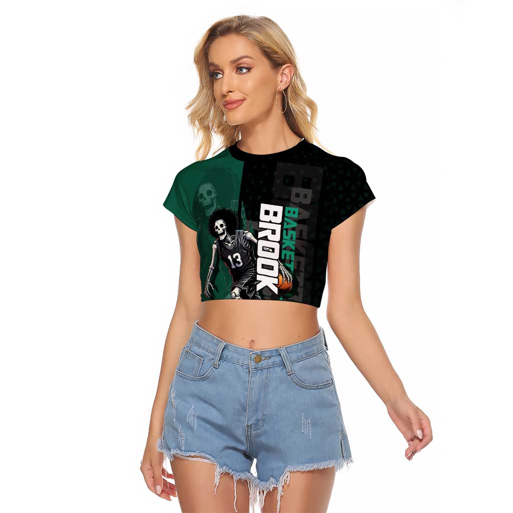 Brook One Piece Basketball Theme Green and Black Design Raglan Cropped T Shirt with Skull Emblem and Energetic Pose - The Mazicc