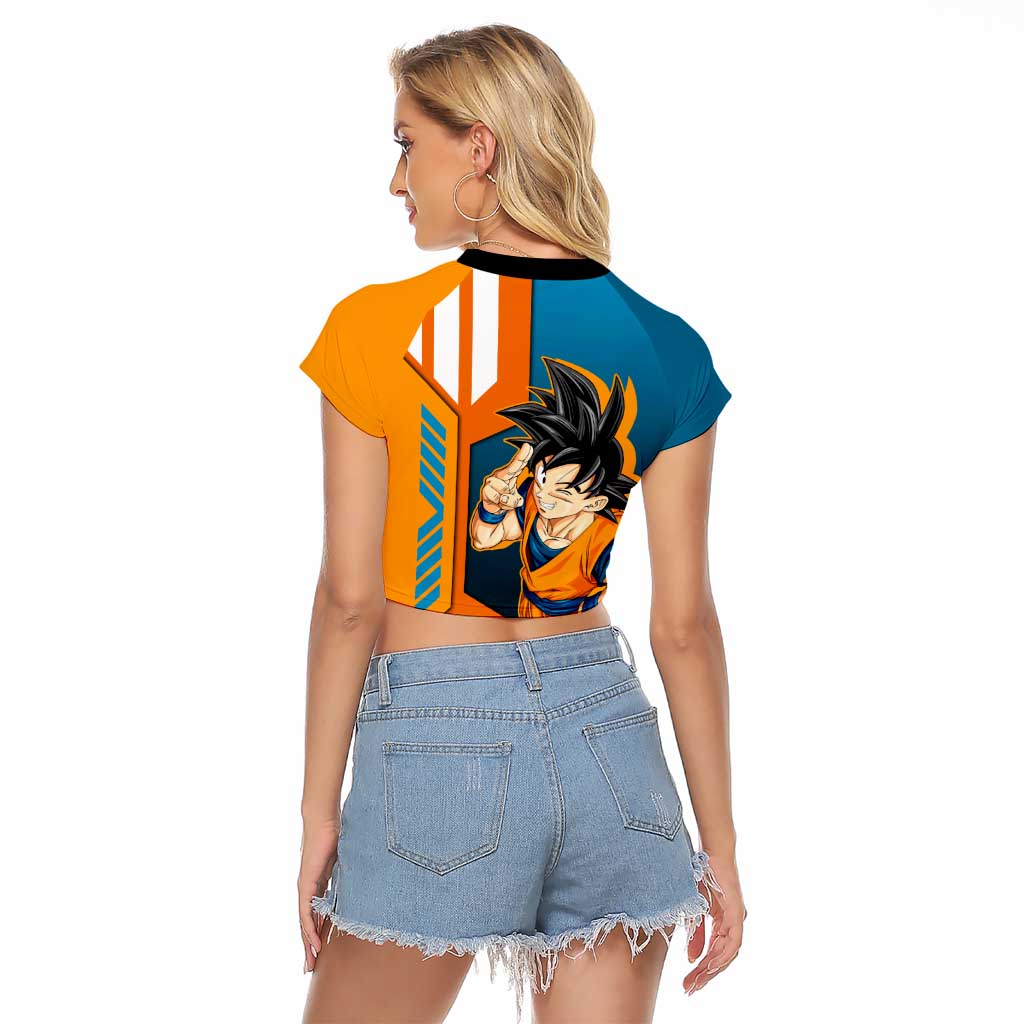 Son Goku from Dragon Ball Raglan Cropped T Shirt with Orange Gi, Power Pose, and Energy Effect Design - The Mazicc
